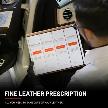 A man holding a Fine Leather Prescription document in his hands.