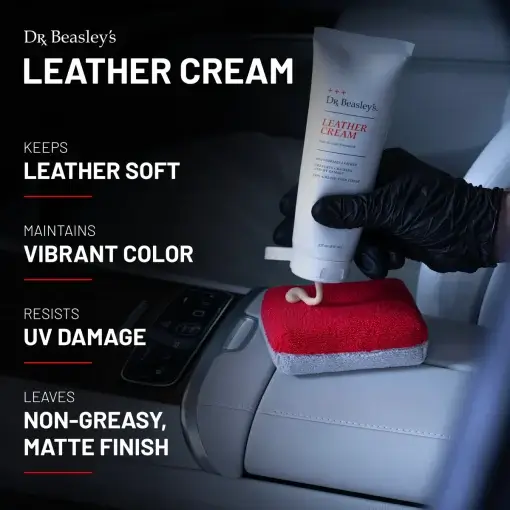 An 8 oz tube of Leather Cream pouring into a white and red applicator inside a white leather interior.