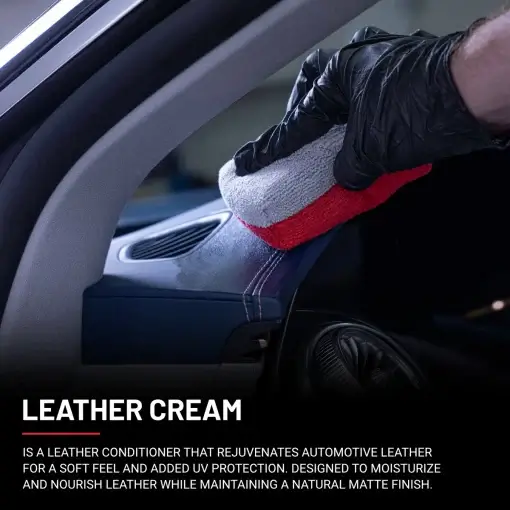Leather Cream being applied to a leather dashboard using a white and red applicator.