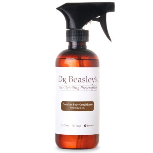 Spray bottle of Premium Body Conditioner against white background.