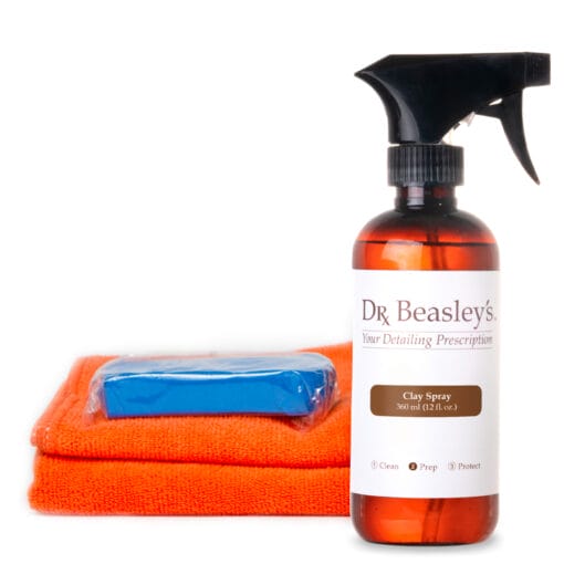 Dr. Beasley's Clay kit featuring one bottle of clay spray, one piece of clay, and two microfiber towels.
