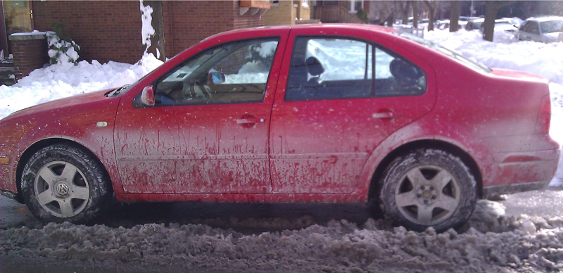 Red Volkswagon Jetta in the Snow