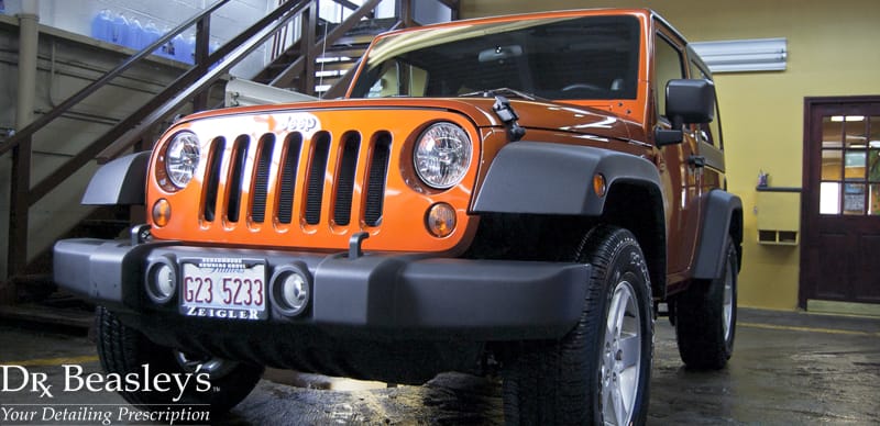 Orange Jeep Wrangler Sport