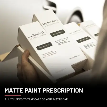 Man holds brand new boxes of Matte Paint Prescription in his hands.