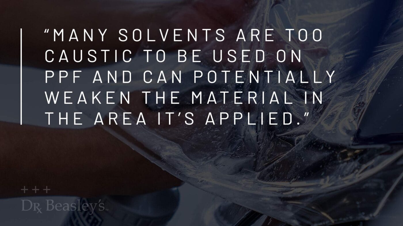 Pull quote reading "Many solvents are too caustic to be used on PPF and can potentially weaken the material in the area it's applied." over an image of PPF being applied to an Audi.