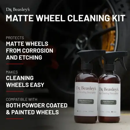 Two bottles of Matte Wheel Seal and Matte Wheel Cleanser displayed in front of matte black Mercedes wheels with yellow calipers.