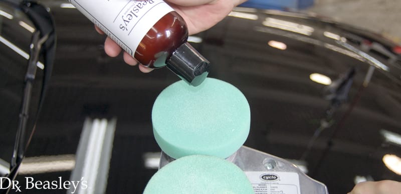 Polish being applied to a pad