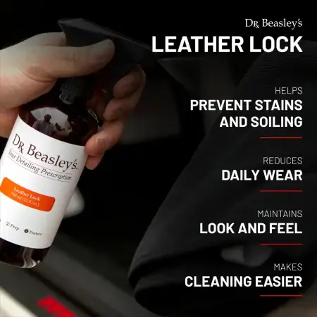 A 12 fl oz bottle of Leather Lock being sprayed onto a microfiber towel.