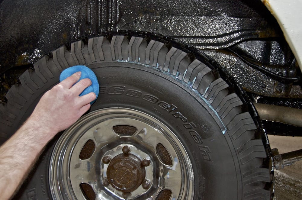 Sling-free tire conditioner being applied to a tire — long-lasting tire dressing formula that bonds to the surface for a clean, lasting finish