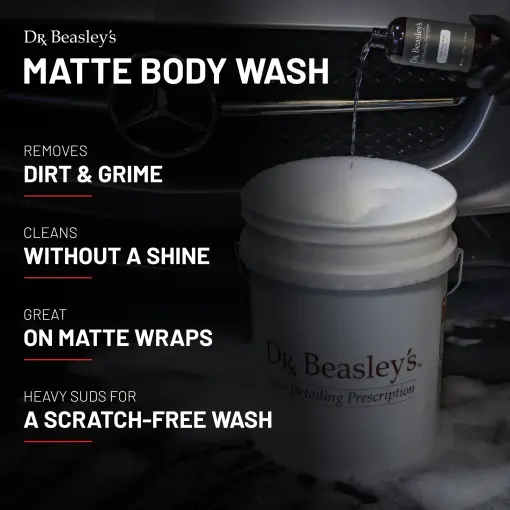 A 12 fl oz bottle of Matte Body Wash pouring into a white bucket with a Matte Grey Mercedes in the background