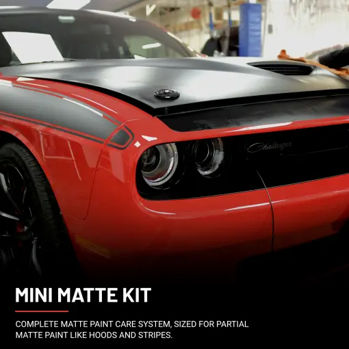 Red Dodge Challenger with matte black hood