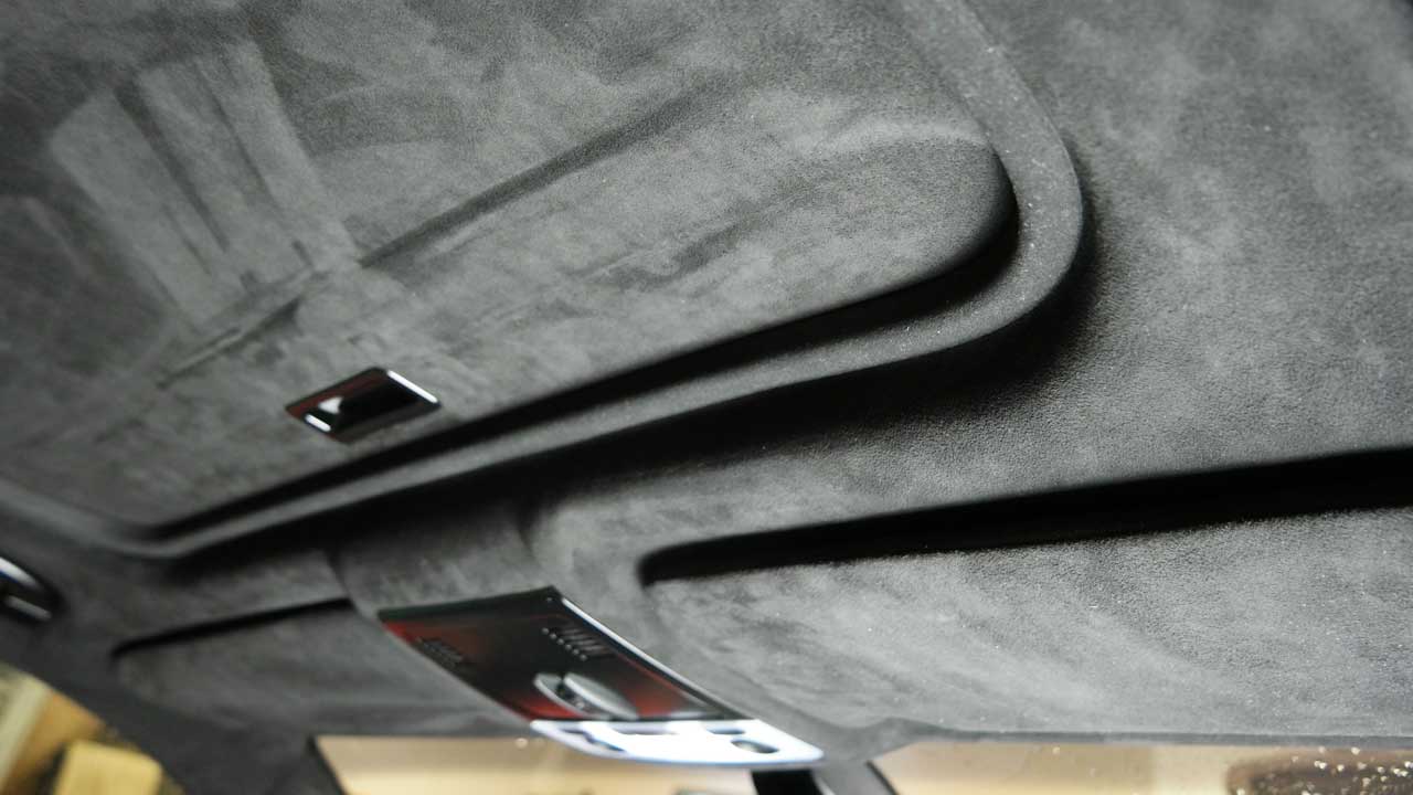 Headliner made of Dinamica fabric inside car