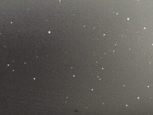 overspray close up on matte black paint