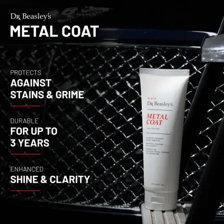 An 8 oz tube of Metal Coat positioned in front of the Bentley chrome front grill.