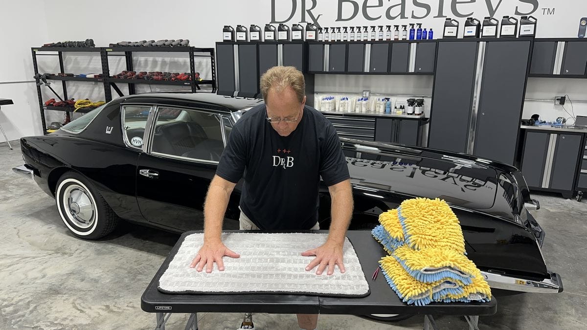 Visually inspecting a microfiber towel.
