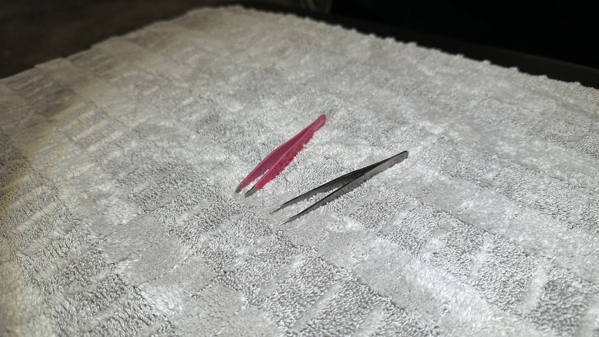 Tweezers for inspecting microfiber towels. 