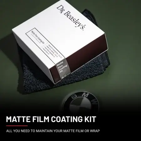 Matte Film Coating Kit displayed on a matte dark green BMW hood.