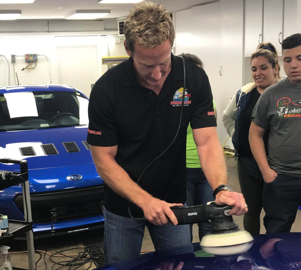 Bruno Massel buffing a car