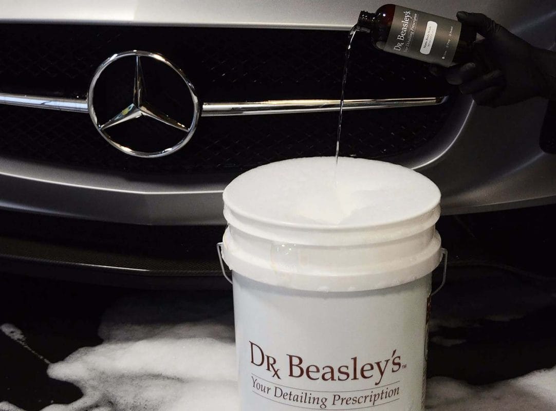 Matte Body Wash pouring into a five gallon bucket