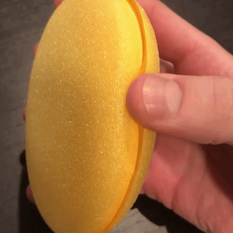 Foam applicator being squeezed