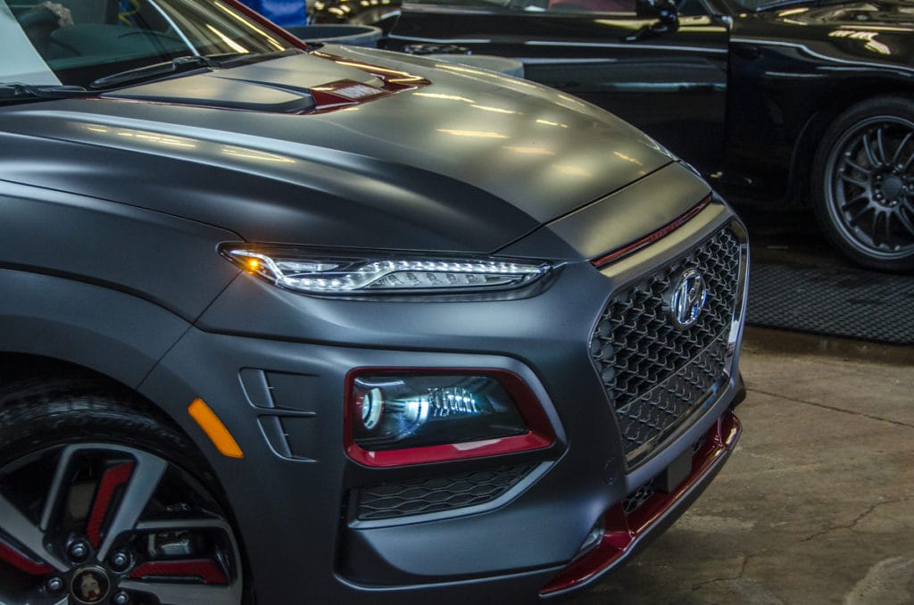Front end of Hyundai Kona Iron Man Special Edition in motion after washing with Dr. Beasley's Matte Body Wash