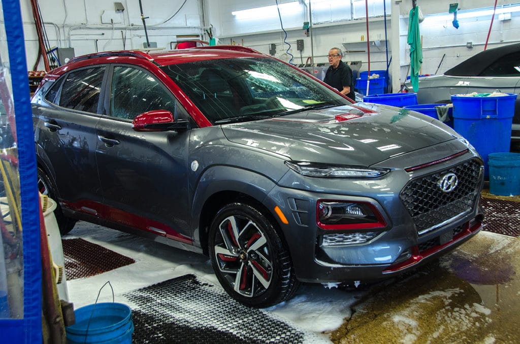 Hyundai Kona Iron Man Special Edition being rinsed after washing with Dr. Beasley's Matte Body Wash