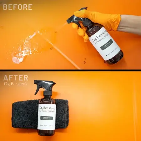 A hand wearing an orange glove sprays Matte Decon on an orange hood with a stain. After: A clean orange hood.