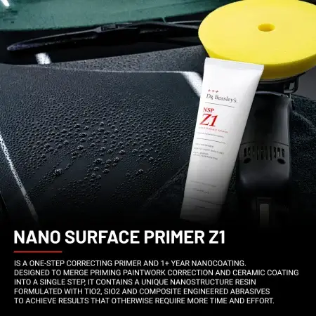 NSP Z1 8 oz tube beside a black buffing machine with a yellow pad, showcasing a black hood with water drop beading.