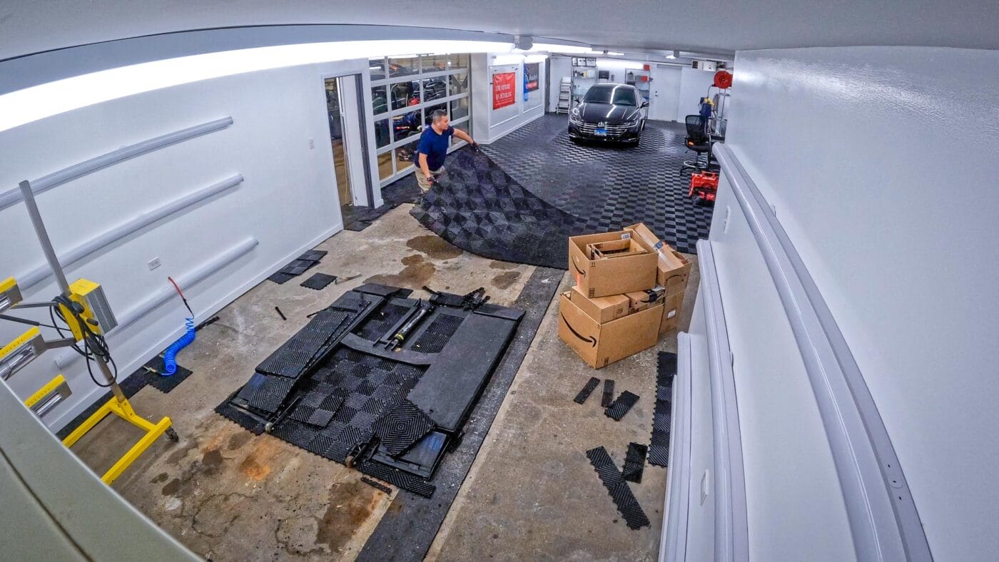 Tile being removed from detailing garage