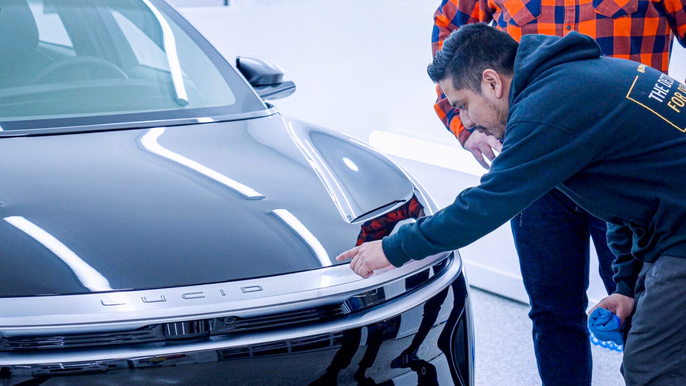 Detailer inspects Lucid Air Dream Edition Performance
