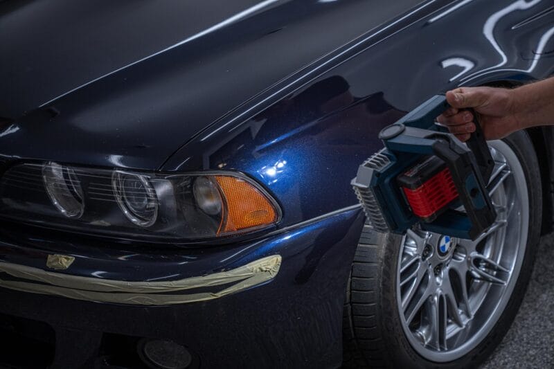 Bosch inspection light being used on E39 m5 front driver-side fender.