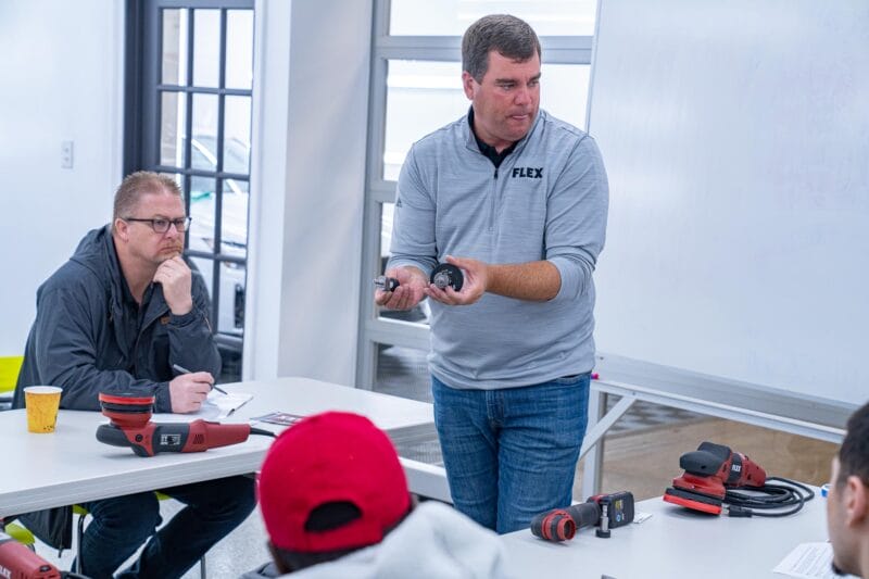 Chris Metcalf with FLEX tools giving a demonstration to detailing students about Backing Plates.