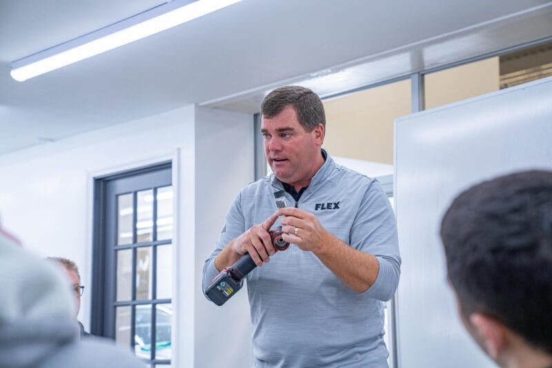 Chris Metcalf with FLEX tools discussing the backing plates of a FLEX product.