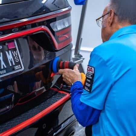 Rear tailgate of Dodge Durango being paint corrected during Dr. Beasley's Future of Detailing Clinic.