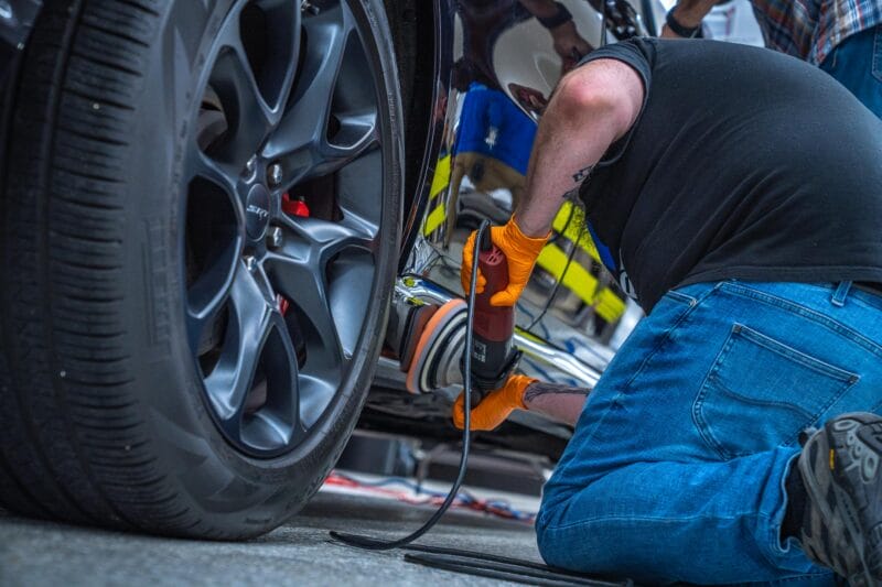 Rocker Panels of Dodge Durango being buffed at The Future of Detailing clinic.