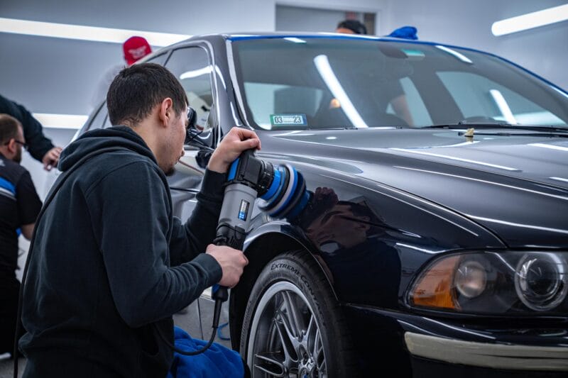 Student tackles the front fender of an E39 M5 as they learn to Paint Correct a vehicle.