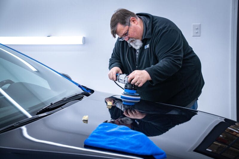 Hood of E39 M5 being paint corrected, at Dr. Beasley's Future of Detailing Clinic.
