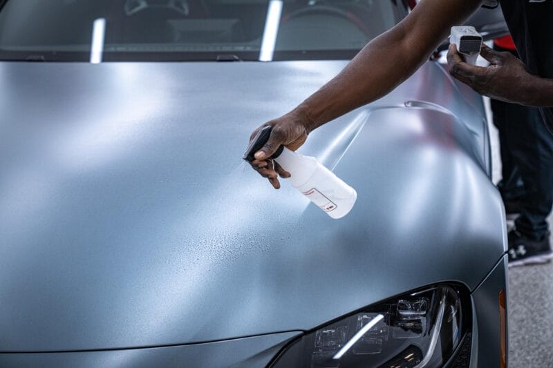Spraying distilled water onto hood