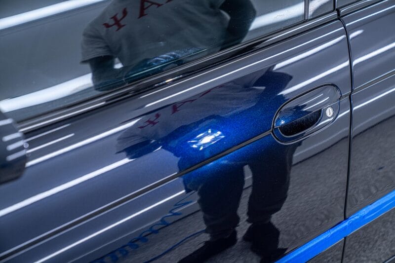 Inspection light being used on E39 M5 driver-side door during Dr. Beasley's Future of Detailing Clinic.