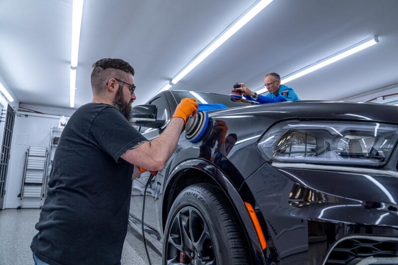 Dodge Durango being paint corrected on the roof as well as the passenger-side fender.