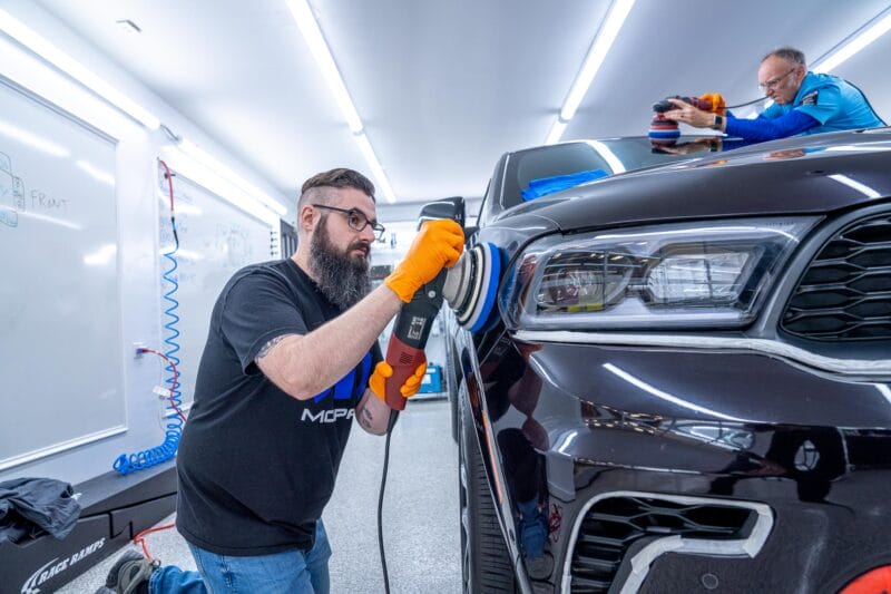 Dodge Durango being paint corrected on the roof as well as the passenger-side fender.