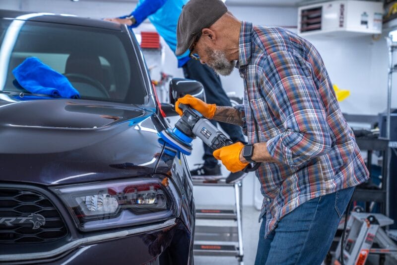 Paint Correction being conducted on driver-side fender of Dodge Durango.