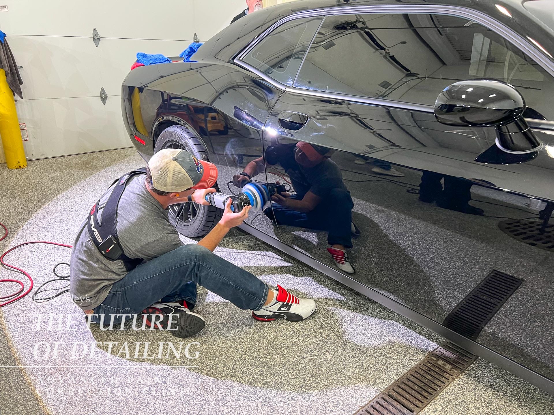 Student polishing the quarter panel on a Hellcat.