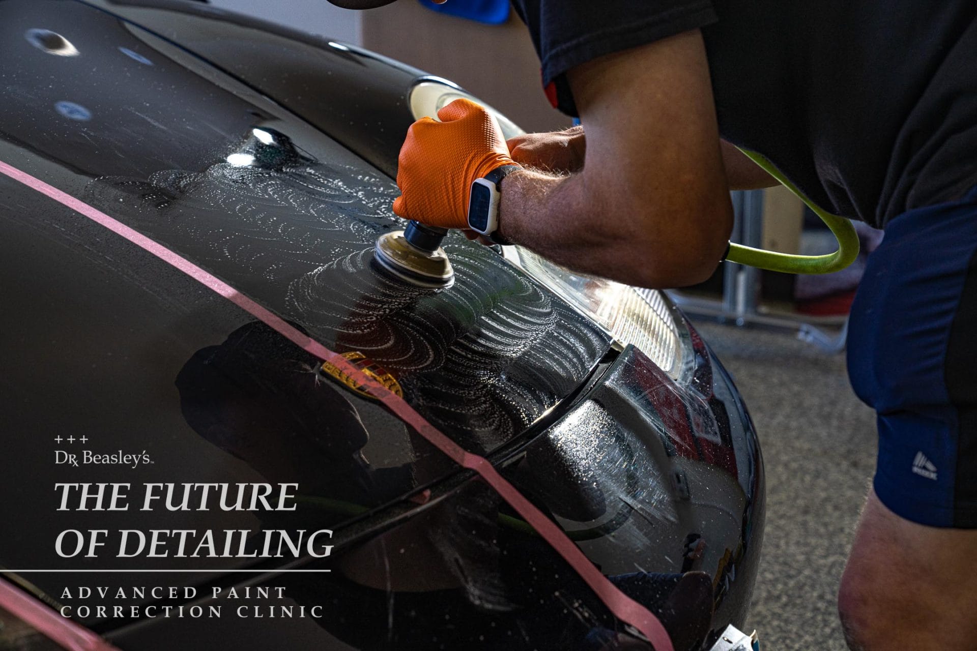 Student wet sanding a Porsche 911 hood.