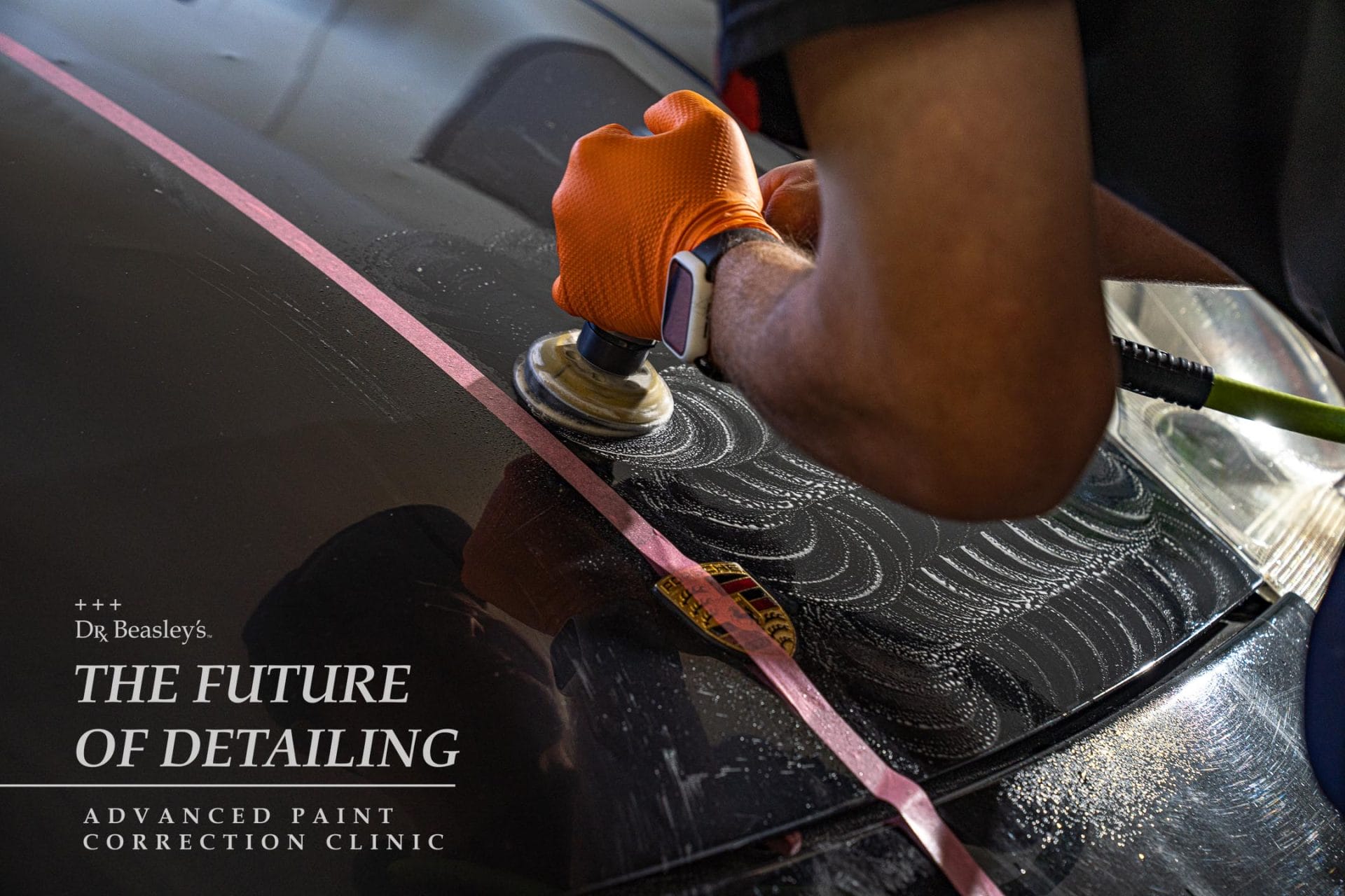 Student wet sanding a Porsche 911 hood.