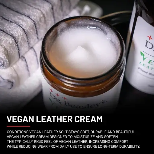 An open jar of Vegan Leather Cream with white cream inside.
