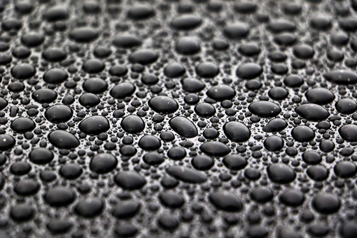 Water beads on a paint surface treated with Bead Hero.