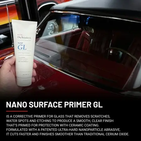 A hand holds an 8 oz tube of NSP Gl in front of recently primed clear glass.