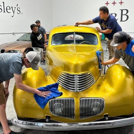 Ceramic coating a vintage car at a Mike Phillips detailing class.