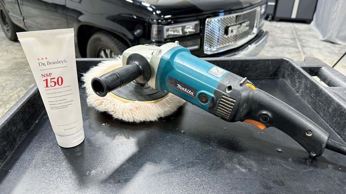 Cutting compound with Makita buffer and wool pad.